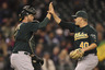SEATTLE:  Relief pitcher Andrew Bailey #40 of the Oakland Athletics is congratulated by catcher Landon Powell #11 after defeating the Seattle Mariners 2-0 at Safeco Field in Seattle, Washington. (Photo by Otto Greule Jr/Getty Images)